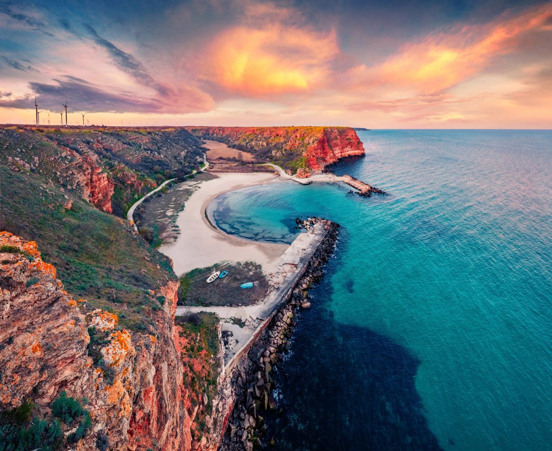 Winter sunrise paints a magnificent scene at Bolata Bay, Varna province, Bulgaria.