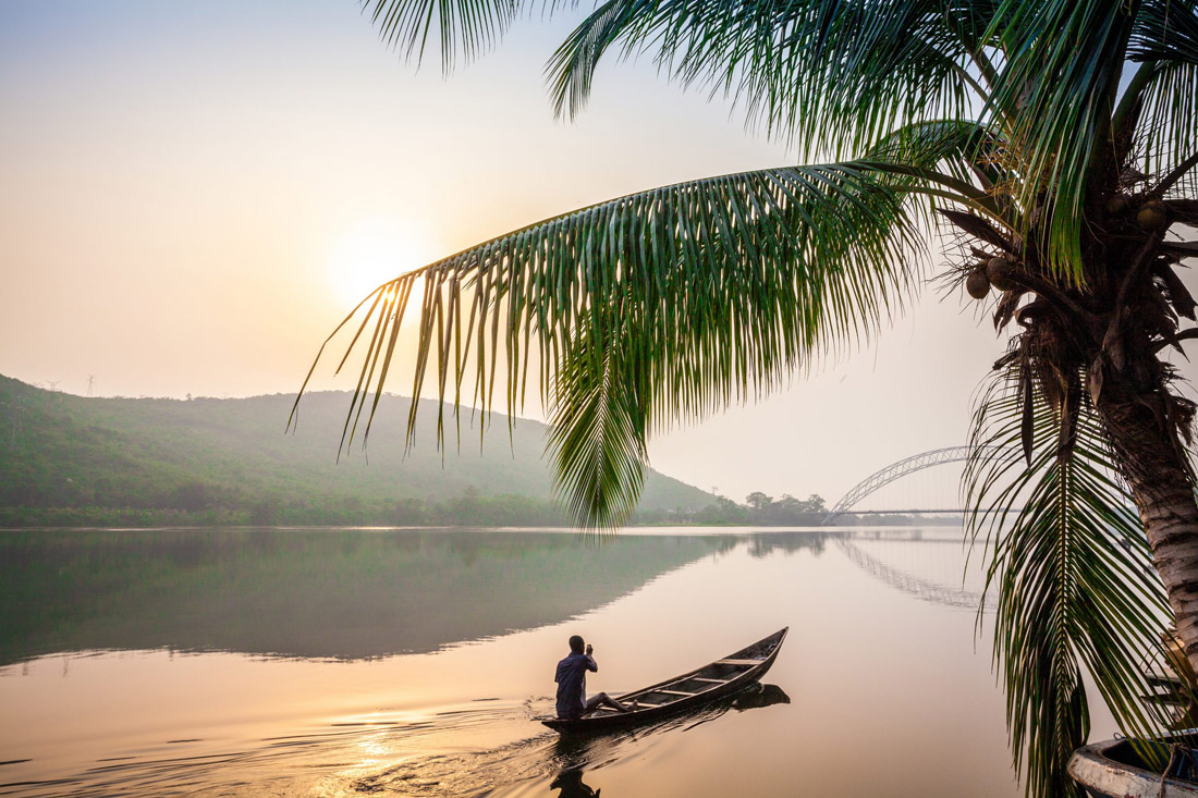 Traditional wooden canoe moored on the shores of Ghana, Africa